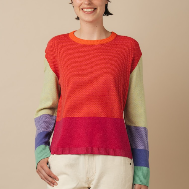 Woman wearing Eribe merino wool Melrose tweed sweater in fraser.