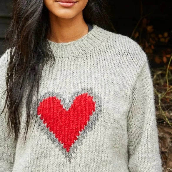 Hand knit from Nepal. 100% wool swetare with heart.