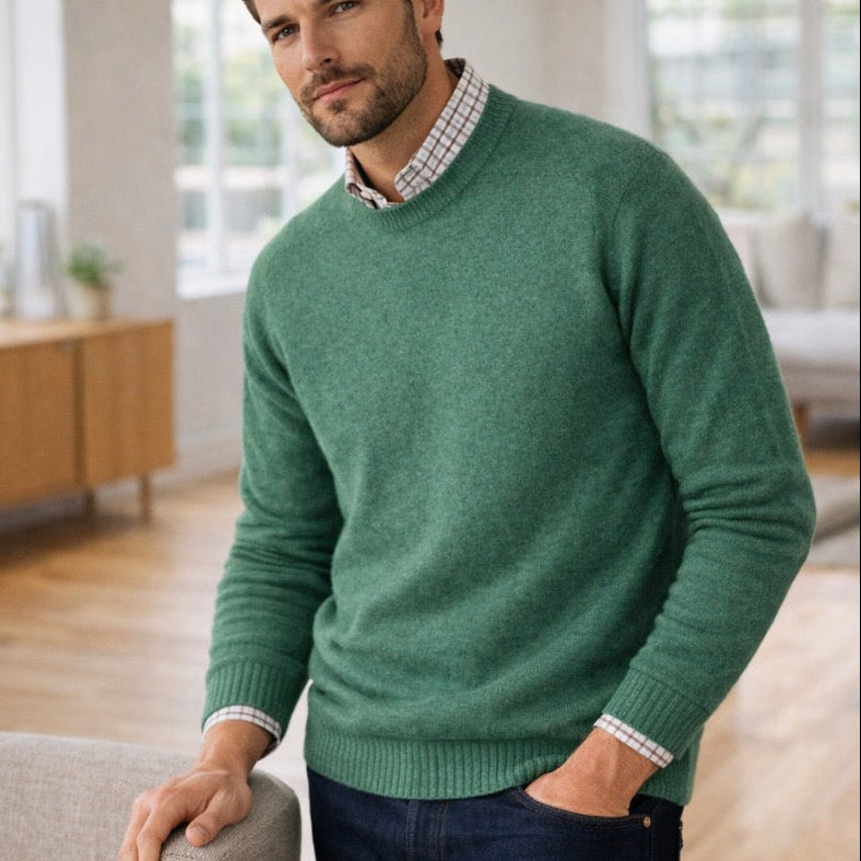 Man wearing a merino wool jumper in green from Harley of Scotland