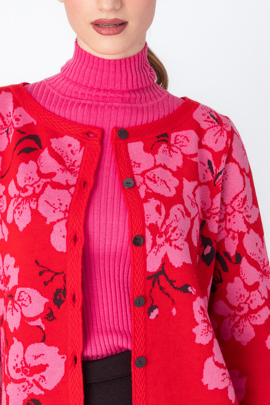 IVKO's round neck cardigan unbuttoned with pink turtleneck