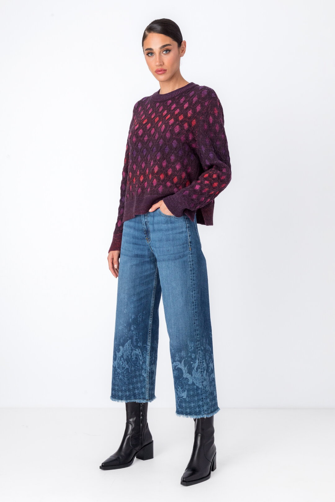 IVKO's newest pullover with structured pattern in brown-red, styled with jeans and boots