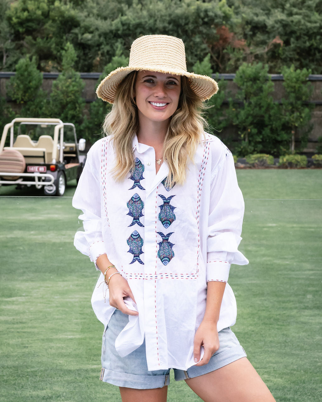 Embroidered fish on white cotton shirt from mandalay Designs