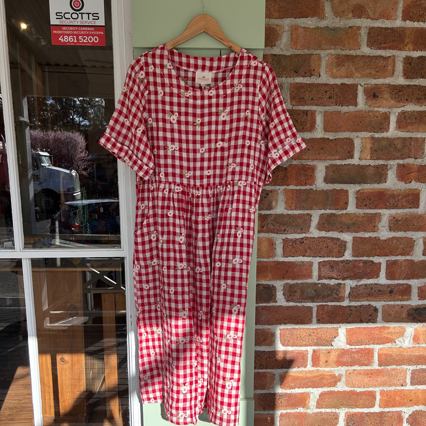 Mandalay Red gingham linen dress with embroidered flowers. Maxi.