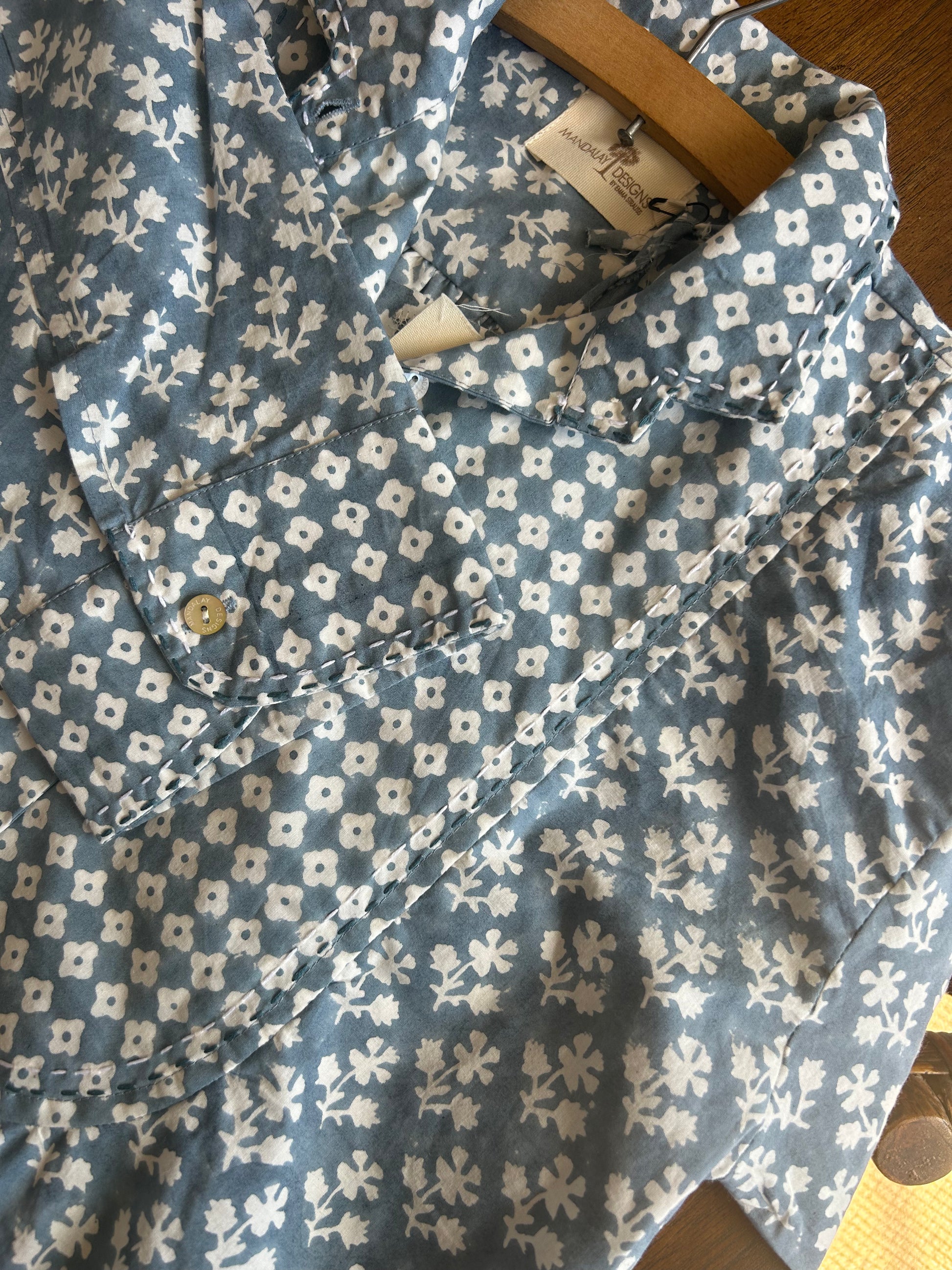Mandalay designs detail in blue shirtdress.