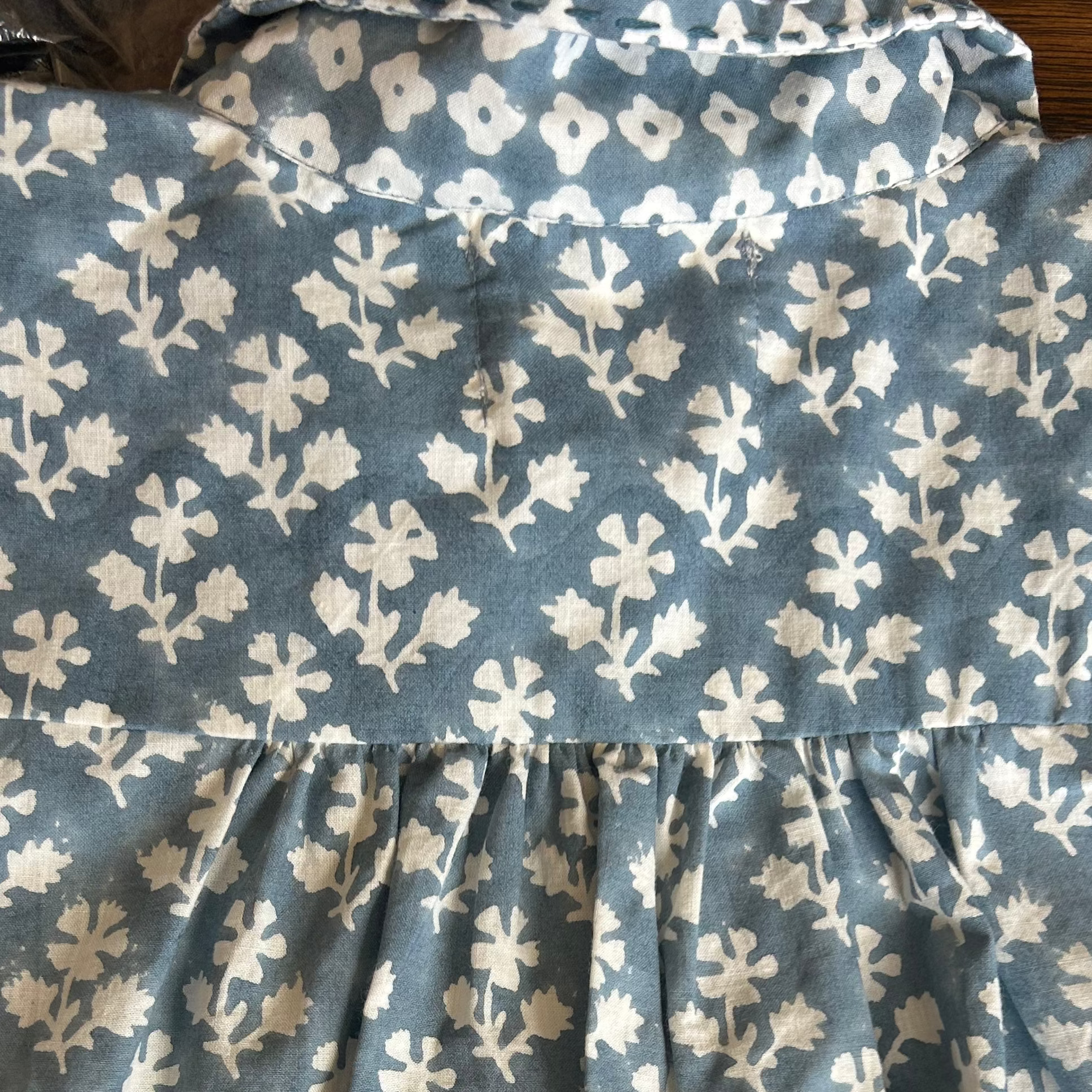 Mandalay Designs back of blue shirt dress.