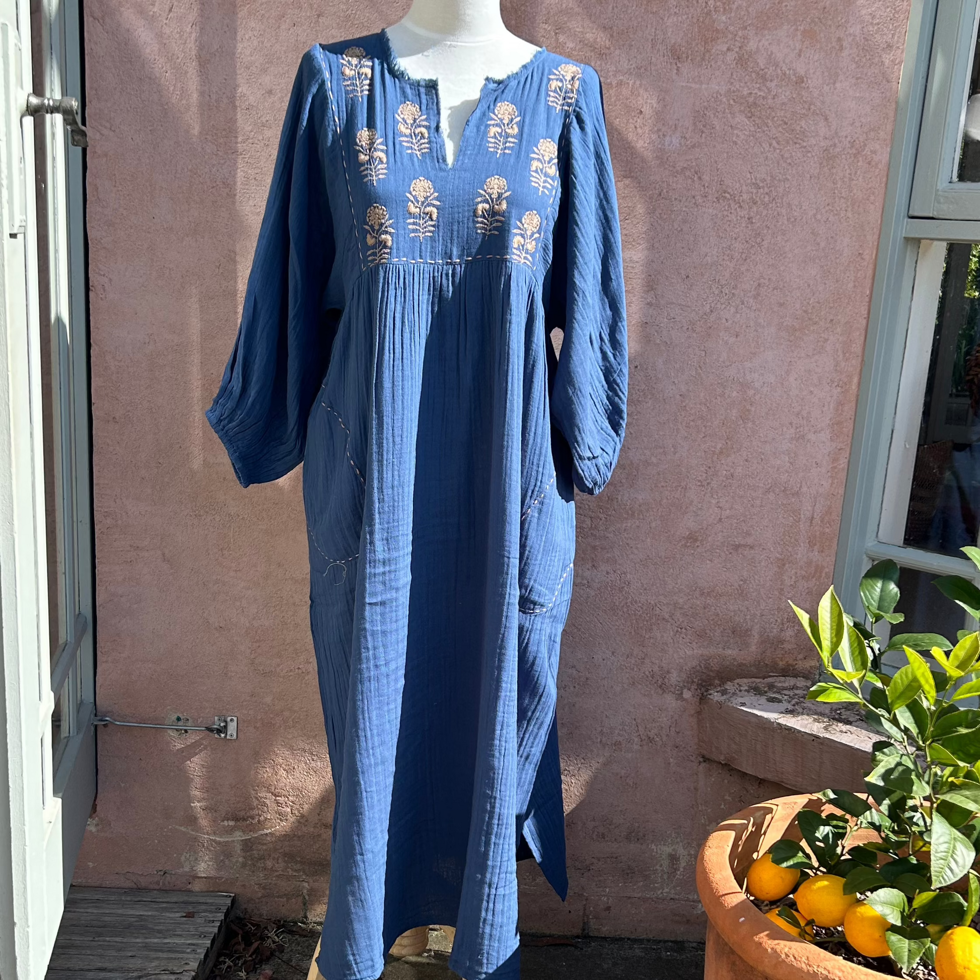 Mandalay Designs maxi dree in blue with embroidery.