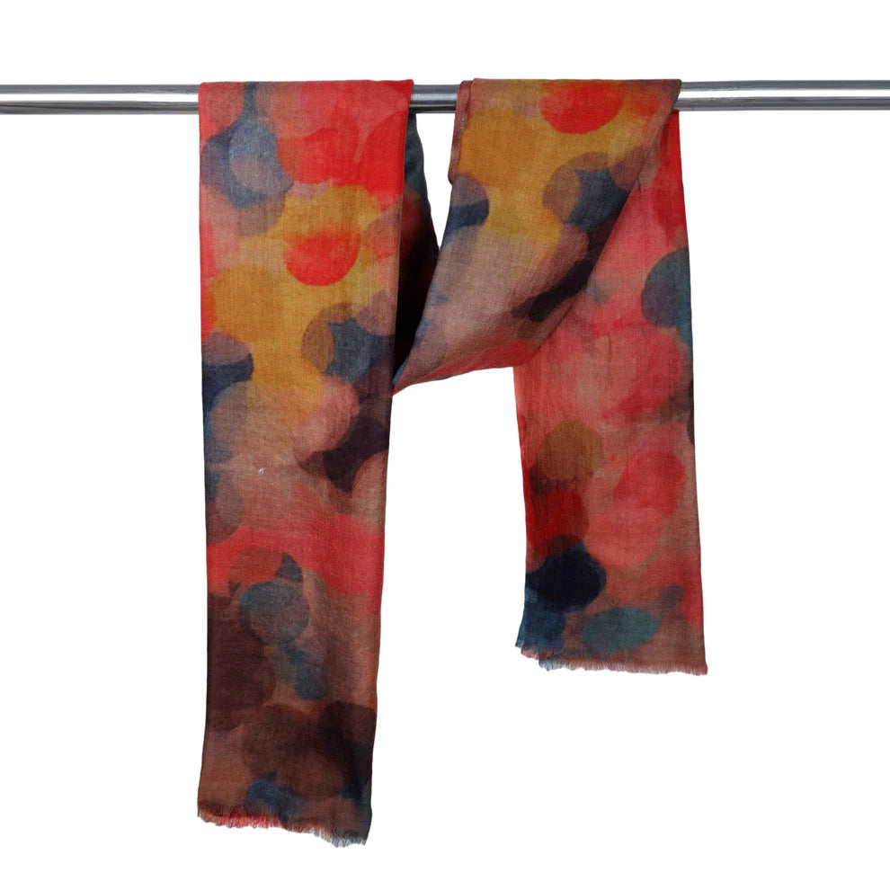 Colorful scarf with abstract pattern on a white background. Merino wool and silk