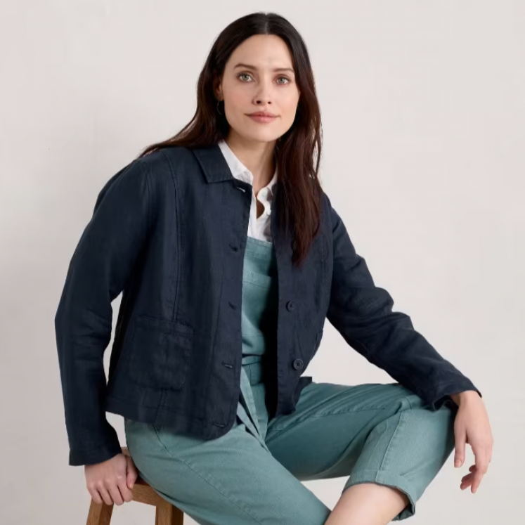 SEASALT's Arame Jacket in Maritime, model on chair