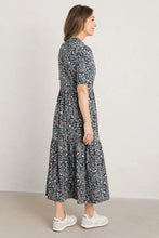 SEASALT's Priddacombe Jersey dress in Ceramic Floral Maritime, 3/4 view and styled with sneakers
