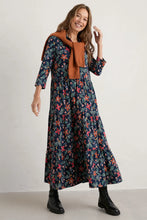 SEASALT's Windflower Dress in Stitched Clematis Maritime, styled with boots and jumper