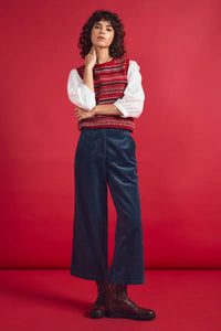 SEASALT's Asphodel Trousers in Maritime, styled with boots and vest