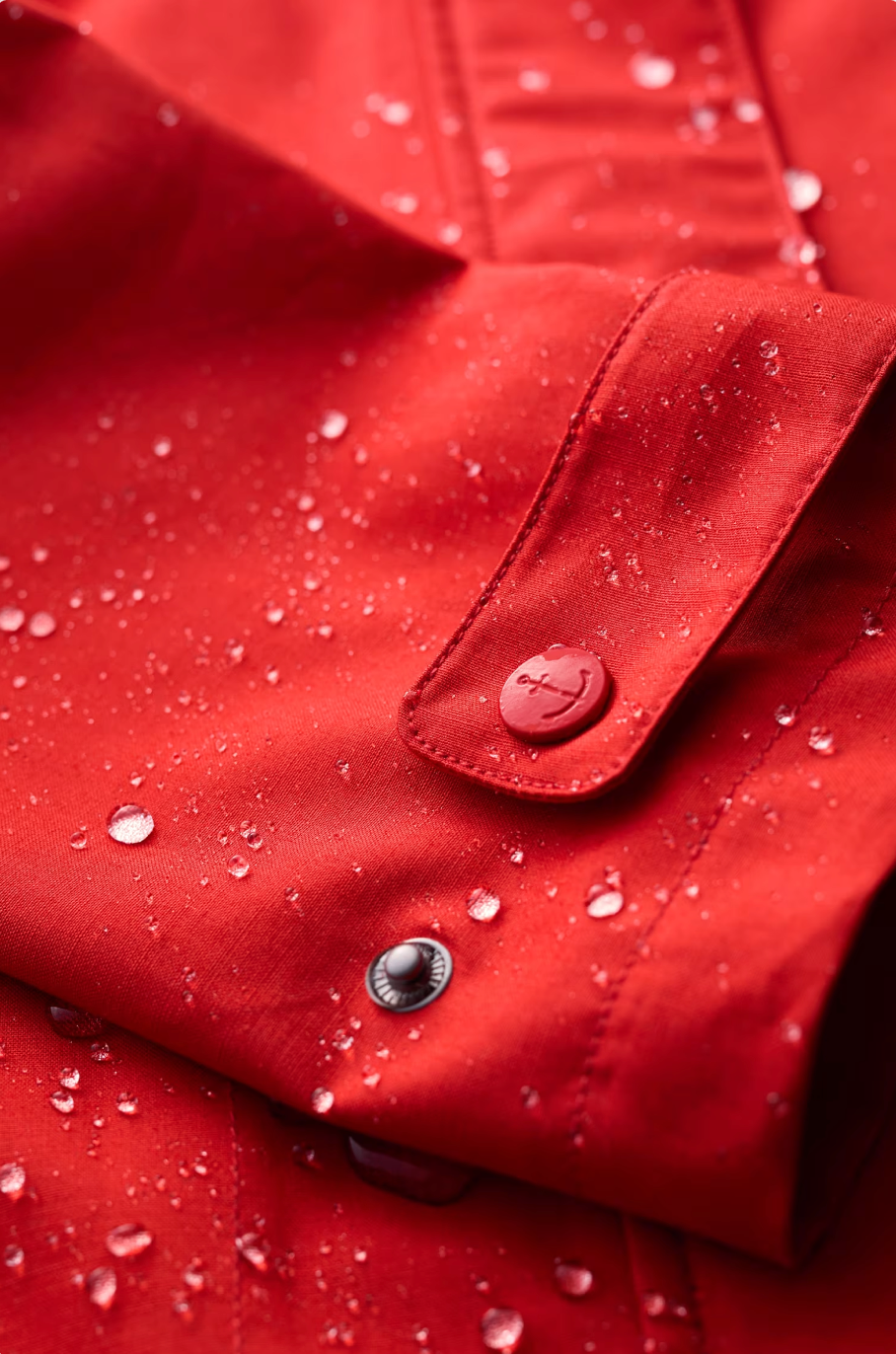 SEASALT's Cloudburst Mac in Tomato, rainproof tin cloth close up