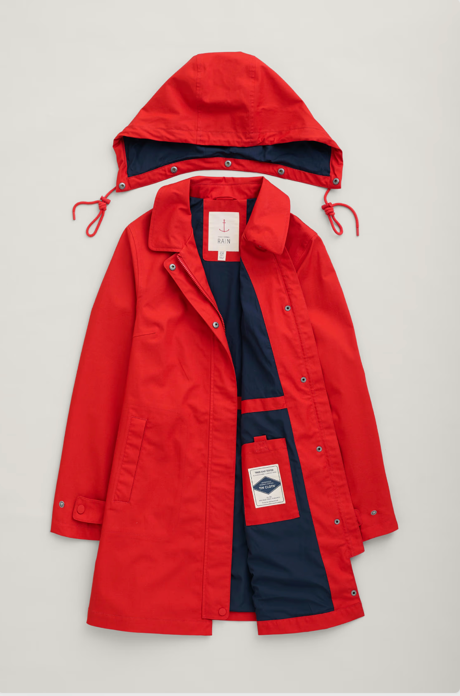 SEASALT's Cloudburst Mac in Tomato, flat lay with removable hood