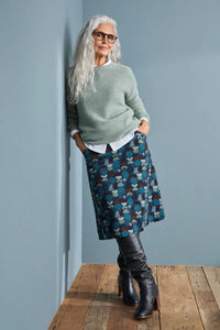 SEASALT's Fruity Jumper in Celadon, styled with skirt and boots