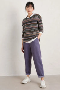 SEASALT's Fruity Jumper in Ripple Marks Wisteria Multi, worn by model with purple pants and sneakers