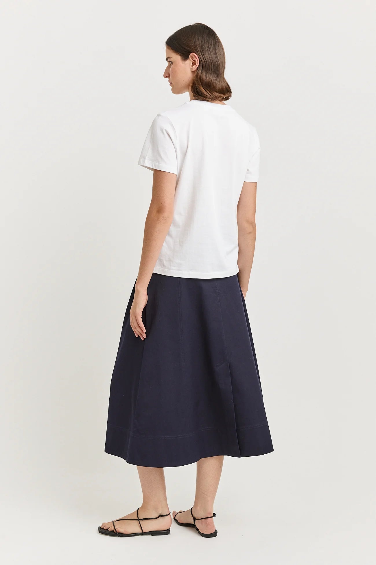 Toorallie t-shirt in white with pleat skirt in navy