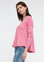 Zaket and Plover's embroided detail jumper, side view of sweater in pink