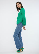 Zaket and Plover's Essential Shirt Bottom in emerald, styled casually with jeans and sneakers
