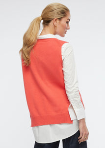 Zaket and Plover's Essential Vest in Dubarry, back view of knitted orange vest