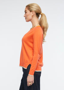Zaket and Plover's Essential Stripe Vee Top in Apricot, side view of ladies jumper