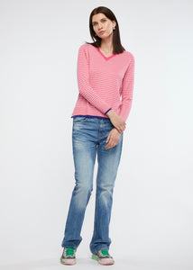 Zaket and Plover's Essential Stripe Vee Top in Barbie, styled with jeans and sneakers