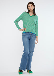 Zaket and Plover's Essential Stripe Vee Top in emerald, styled with heans and sneakers