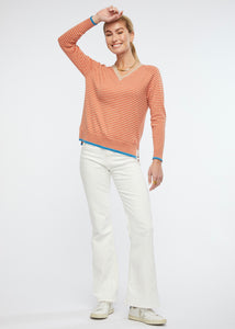 Zaket and Plover's Essential Stripe Vee Top in Oat, styled with jeans and sneakers