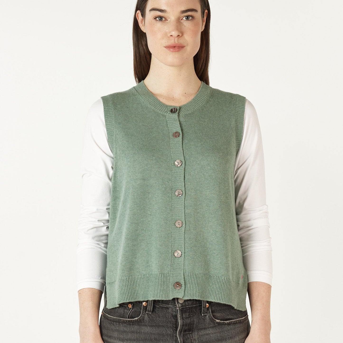 Buttoned womens vest in soft green.