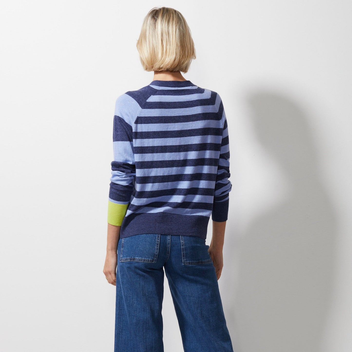 Woman wearing Zaket and Plover's Multi Stripe Cardi in denim