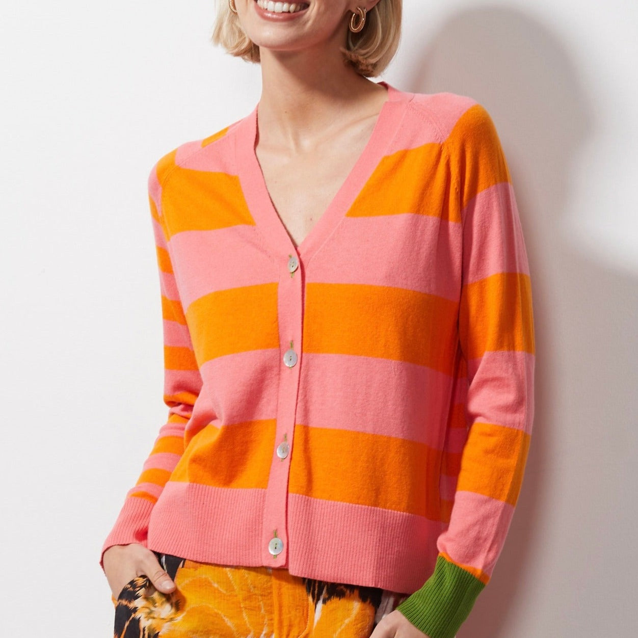 Woman wearing Zaket and Plover's Multi Stripe Cardi in flamingo