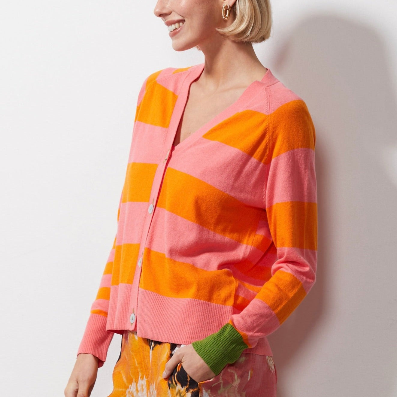 Woman wearing Zaket and Plover's Multi Stripe Cardi in flamingo