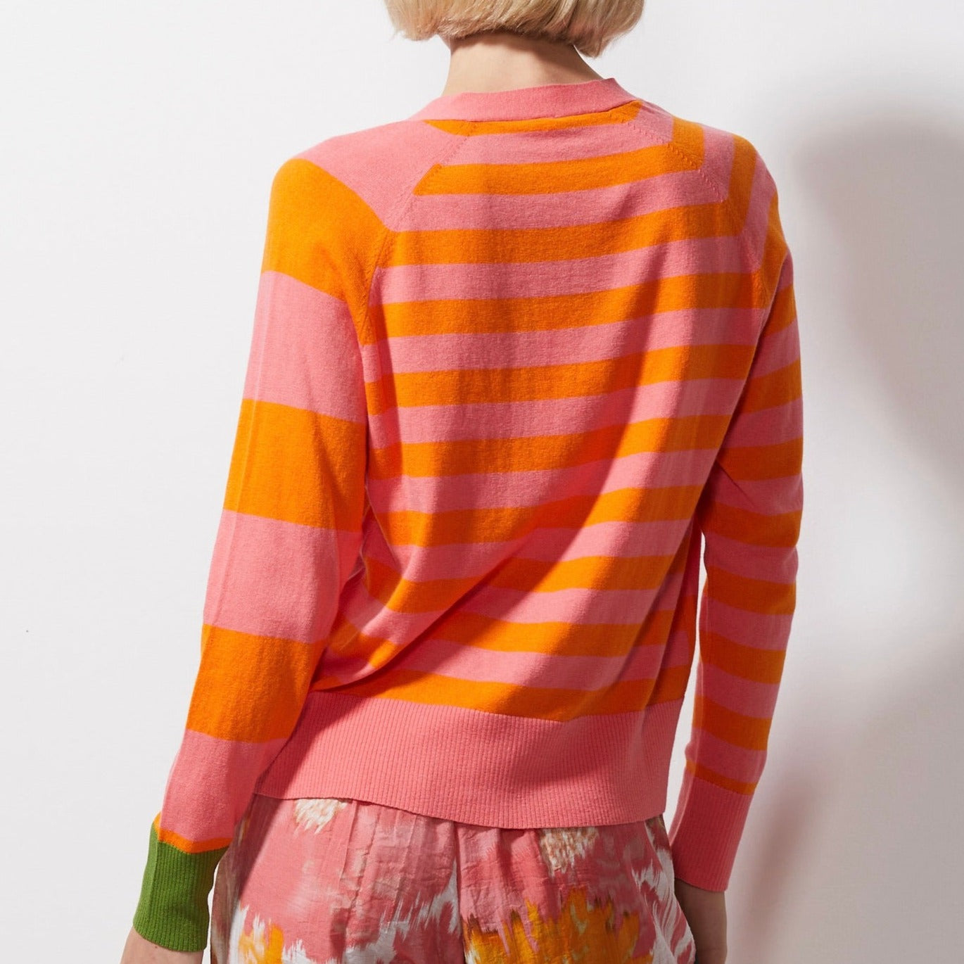 Woman wearing Zaket and Plover's Multi Stripe Cardi in flamingo