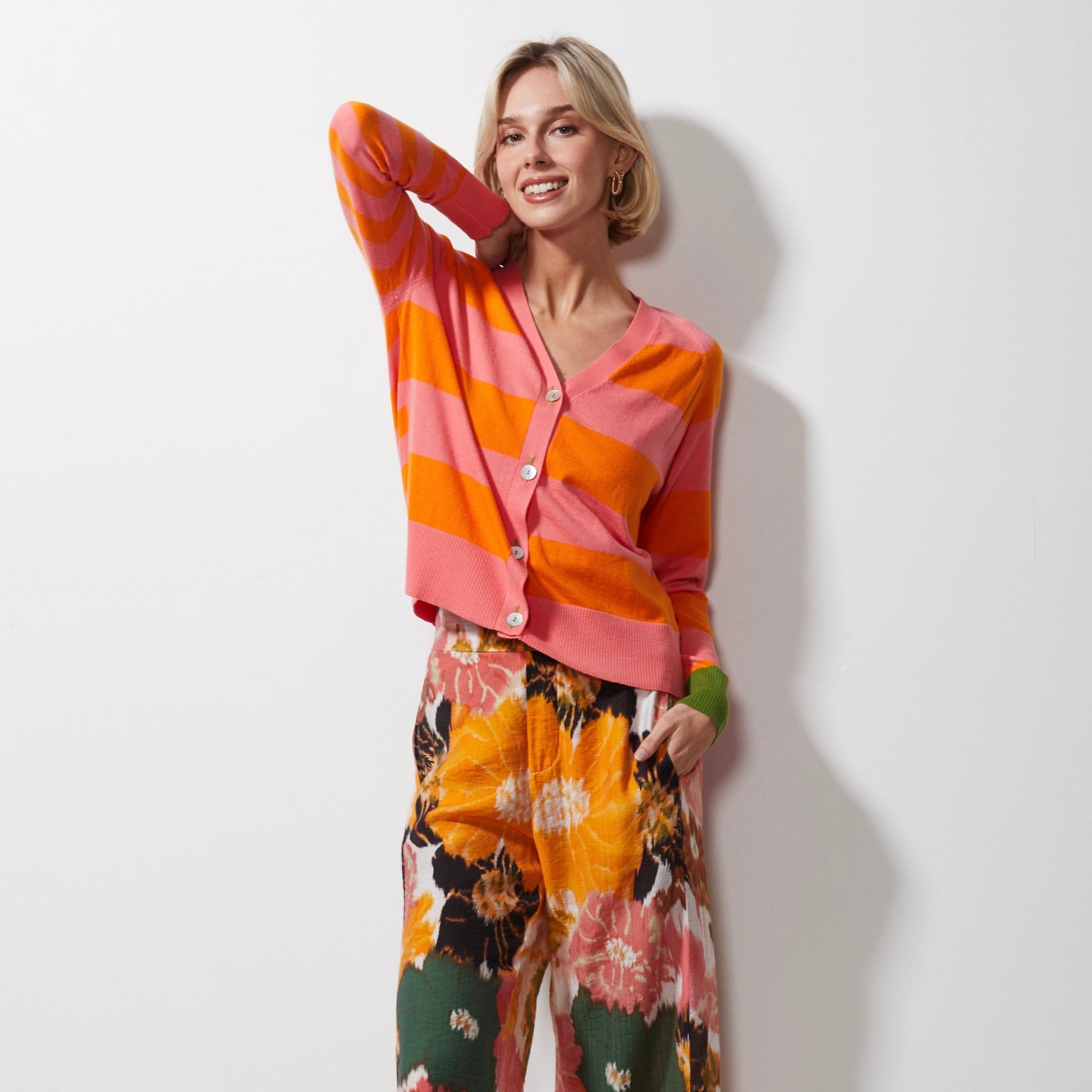 Woman wearing Zaket and Plover's Multi Stripe Cardi in flamingo