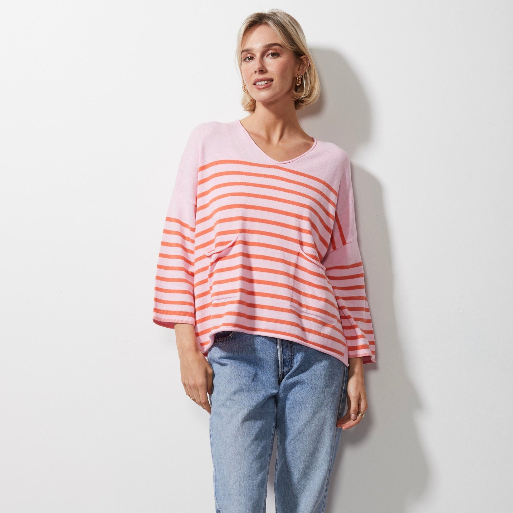 Woman wearing Zaket and Plover's Breton Stripe Vee Jumper in petal