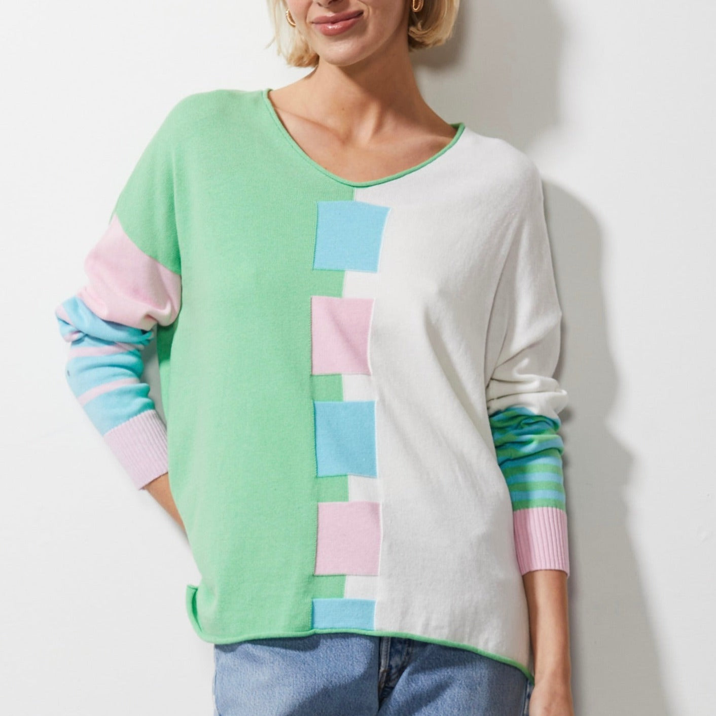 Woman wearing Zaket and Plover's Intarsia squares jumper in butterfly