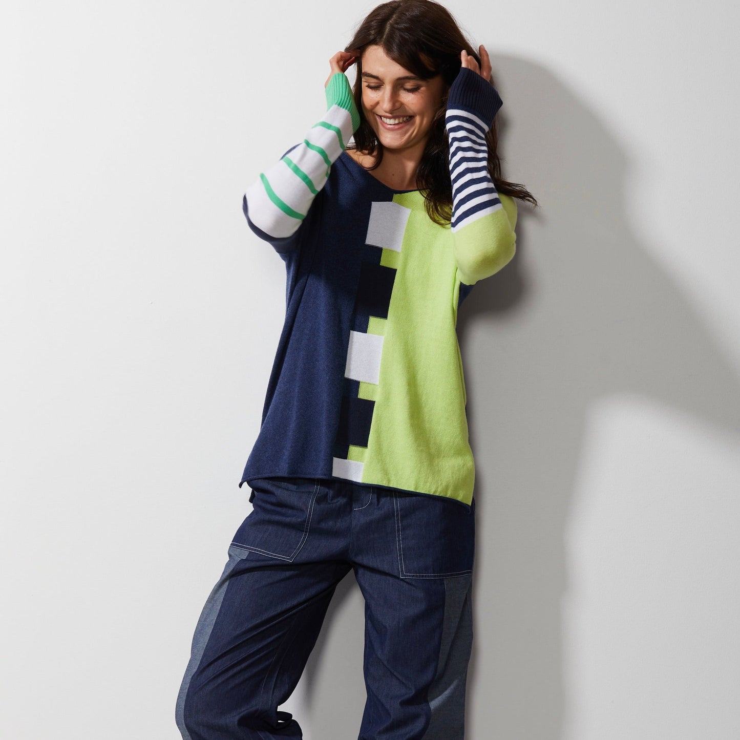 Woman wearing Zaket and Plover's Intarsia squares jumper in denim