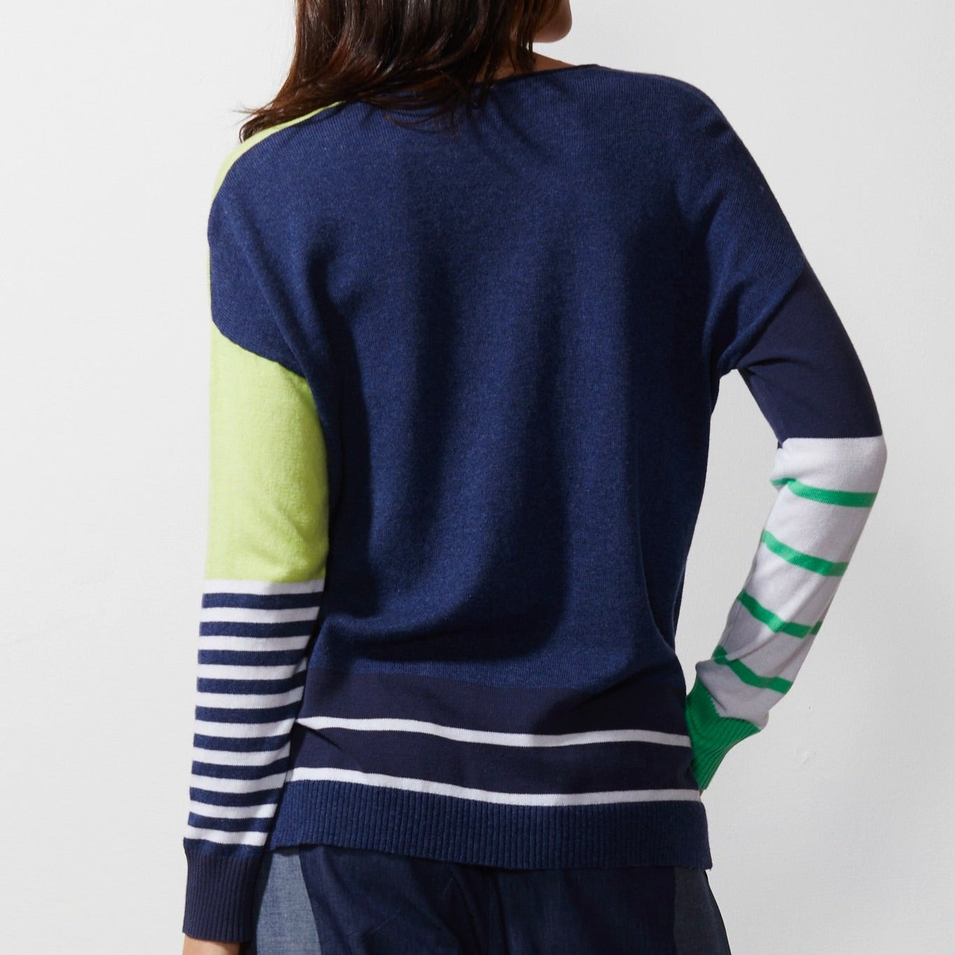 Woman wearing Zaket and Plover's Intarsia squares jumper in denim