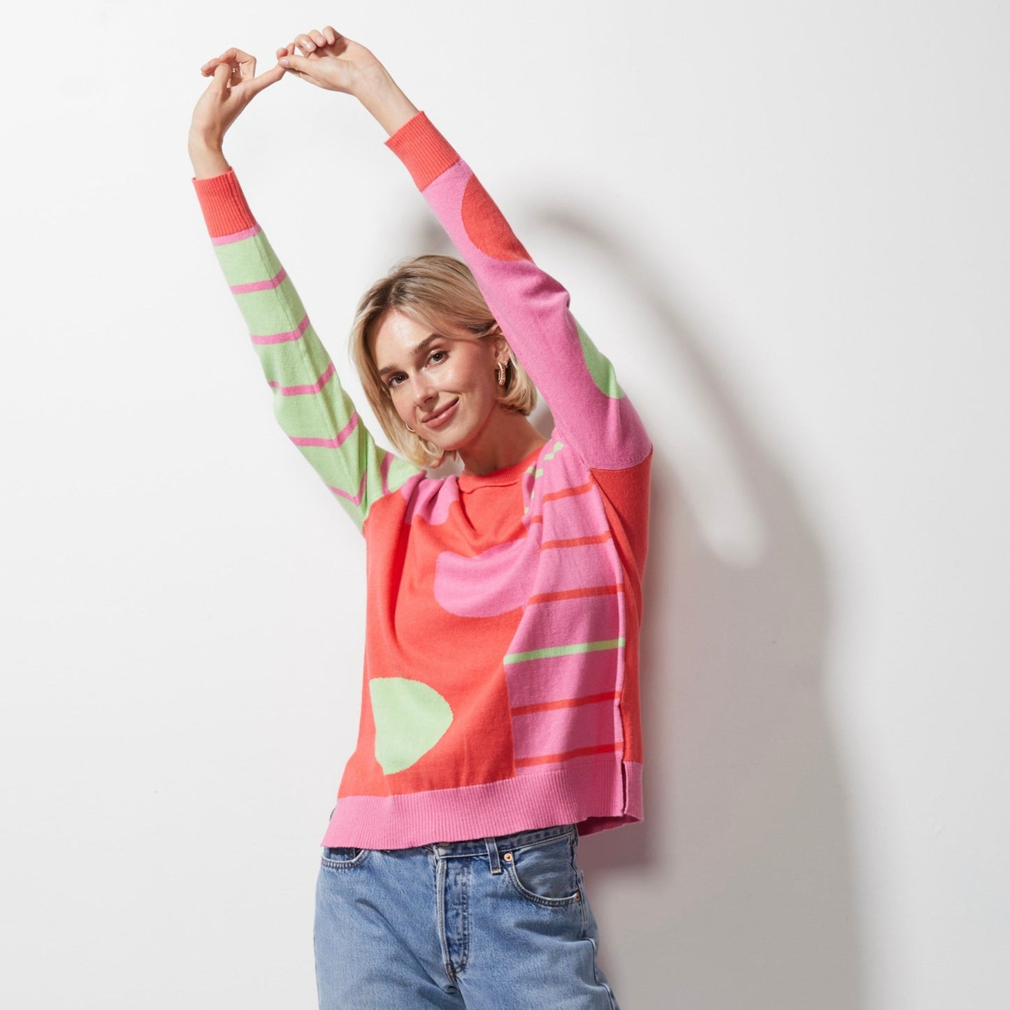 Woman wearing Spot on Stripes Jumper by Zaket and Plover in melon