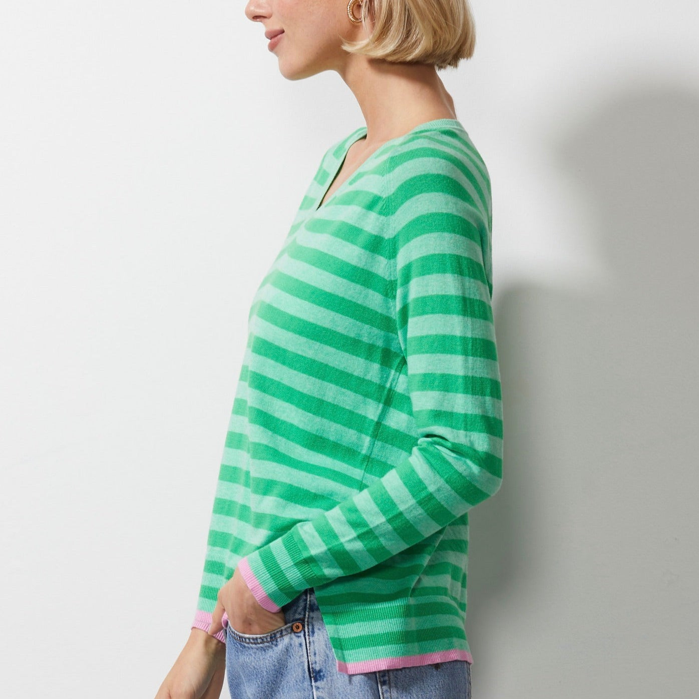 Woman wearing Zaket and Plover's Essential Stripe Vee Sweater in mint