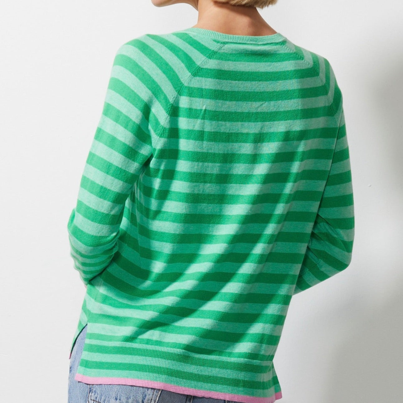 Woman wearing Zaket and Plover's Essential Stripe Vee Sweater in mint