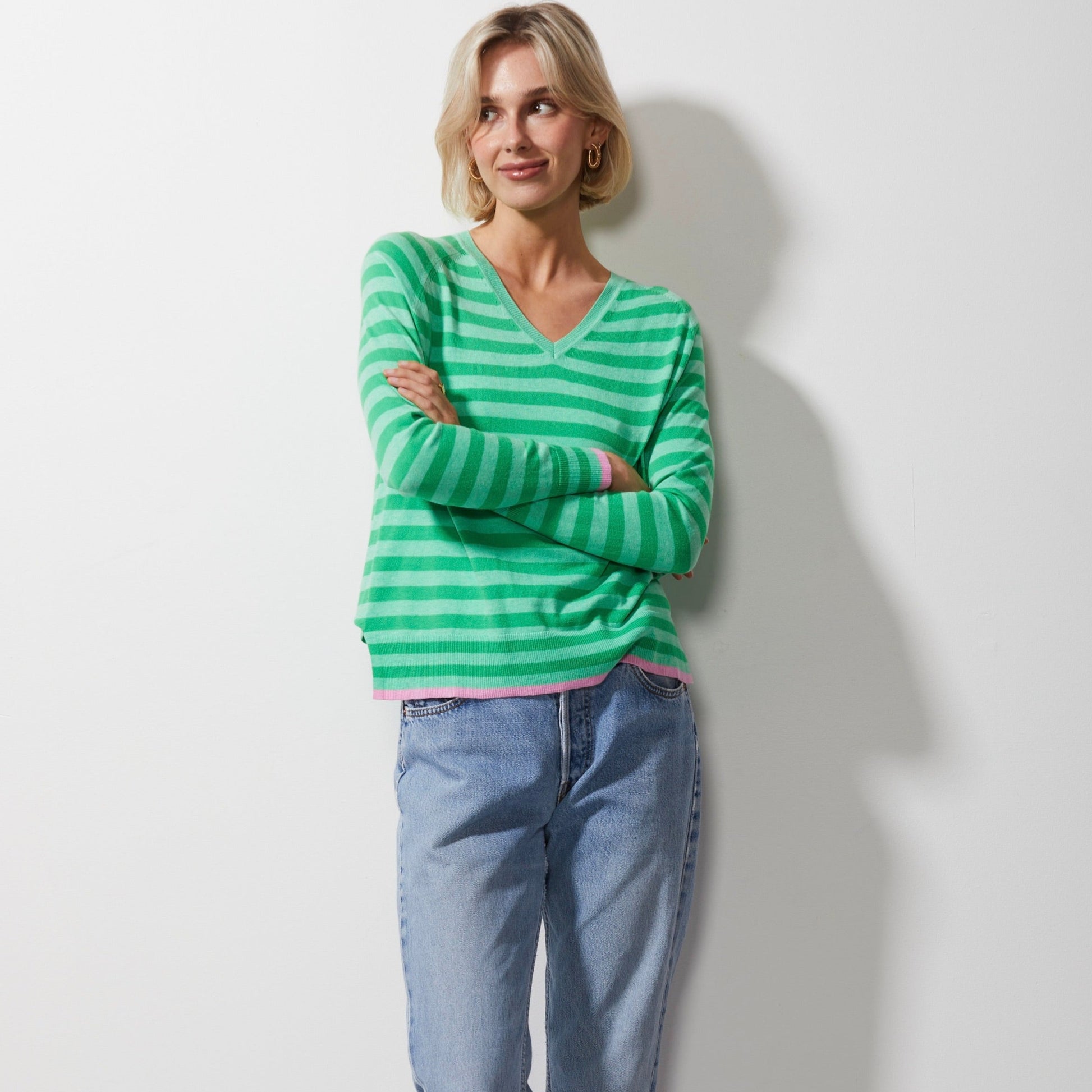 Woman wearing Zaket and Plover's Essential Stripe Vee Sweater in mint