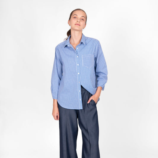 Woman wearing the cotton gingham shirt by bridge and lord in cobalt blue