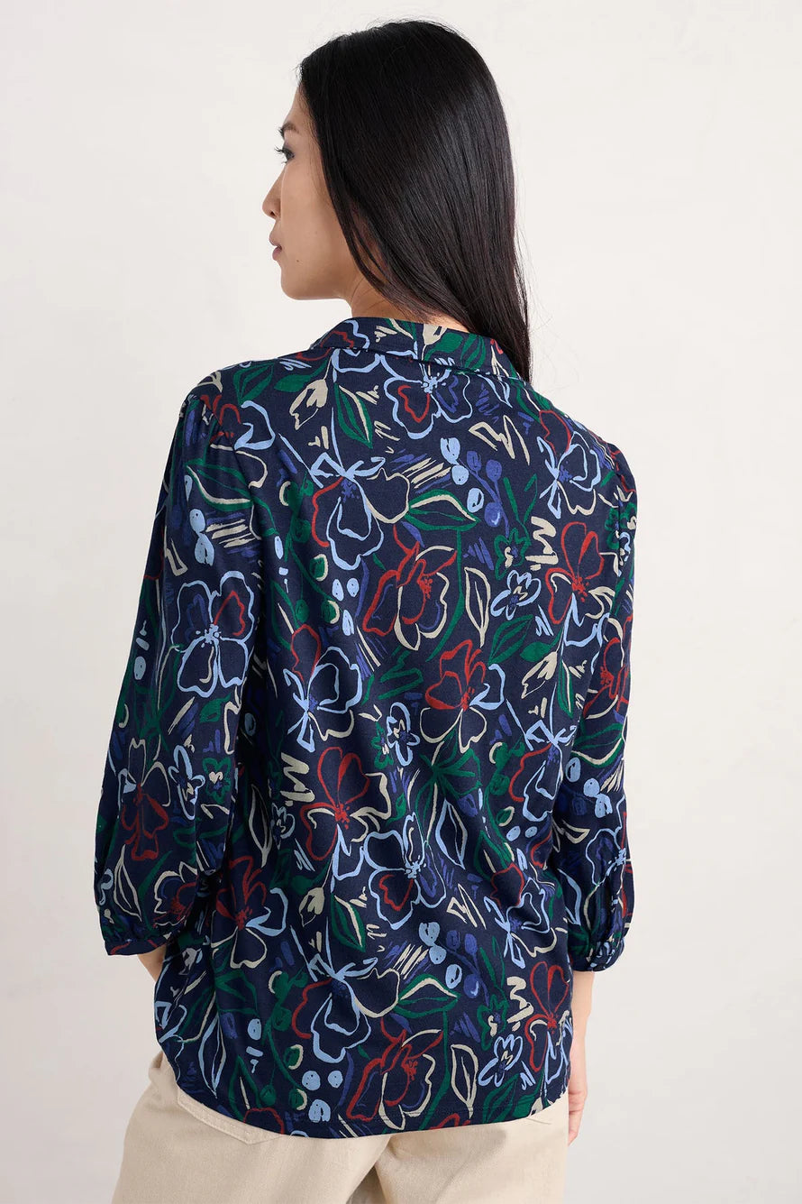 Woman wearing the 3/4 Embrace Shirt by SEASALT in Painters Garden Mix Navy