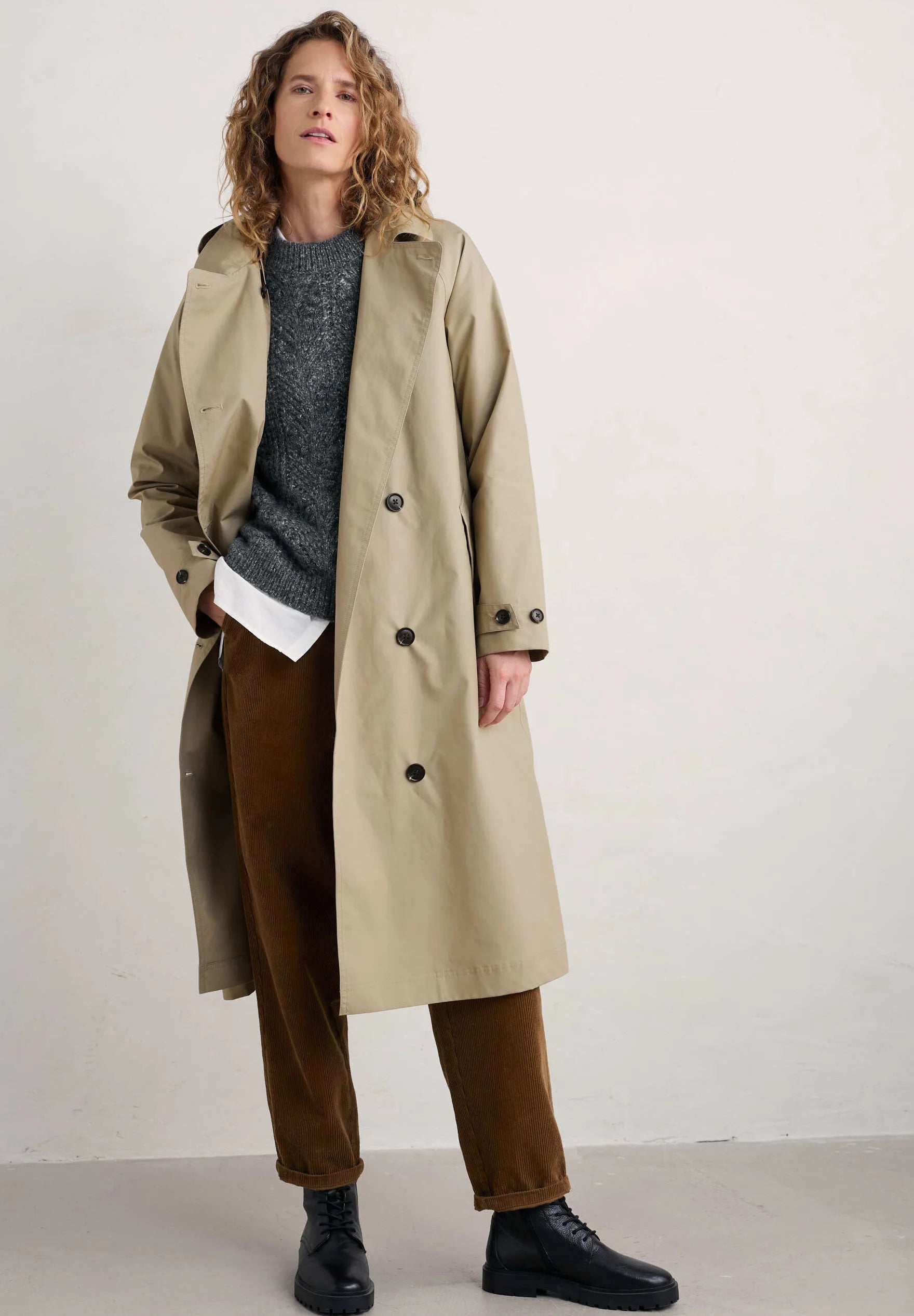 Woman wearing the Penweathers Trench Coat in natural Seed by SEASALT