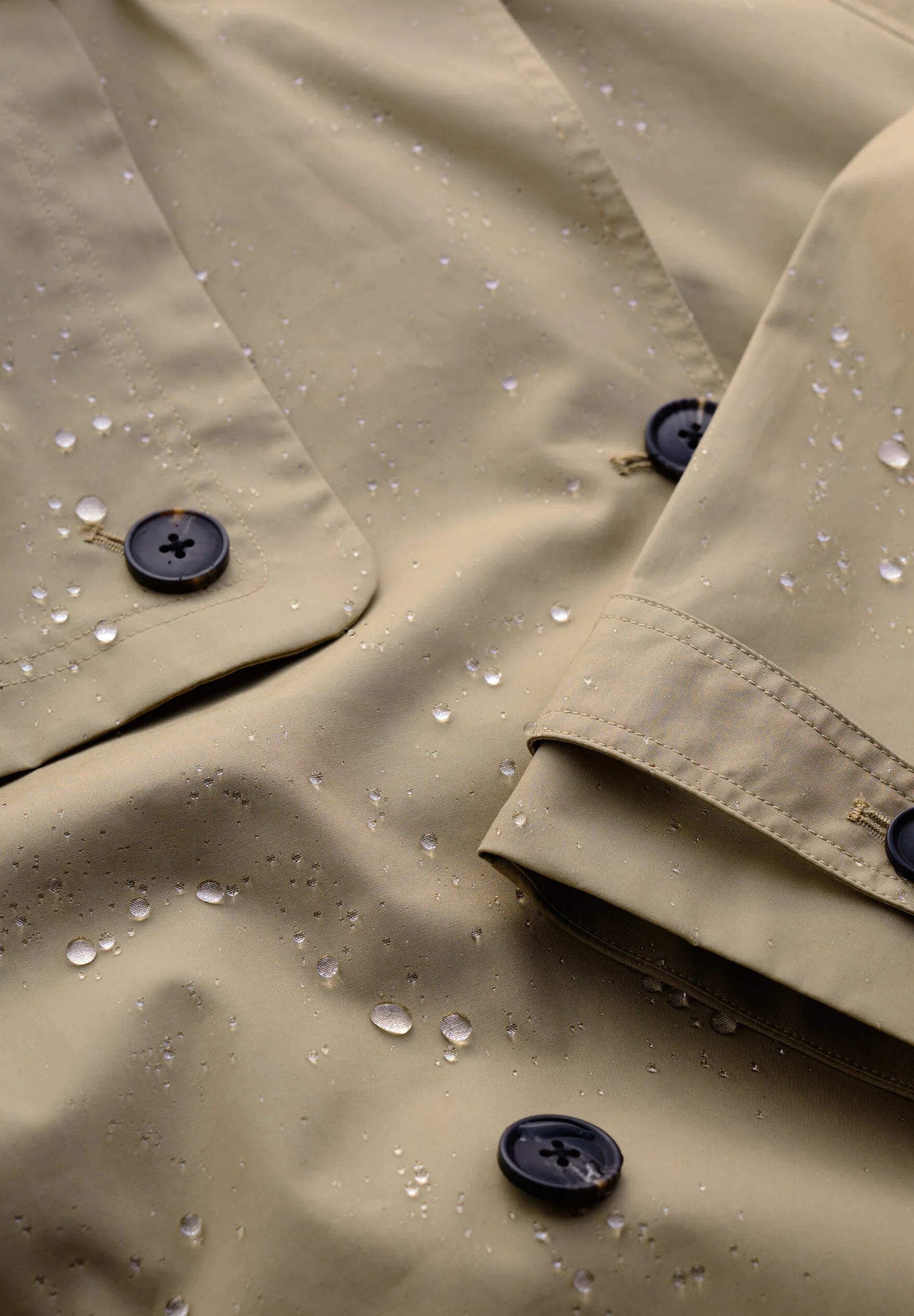 Close up of rainproof fabric in the Penweathers Trench Coat in natural Seed by SEASALT