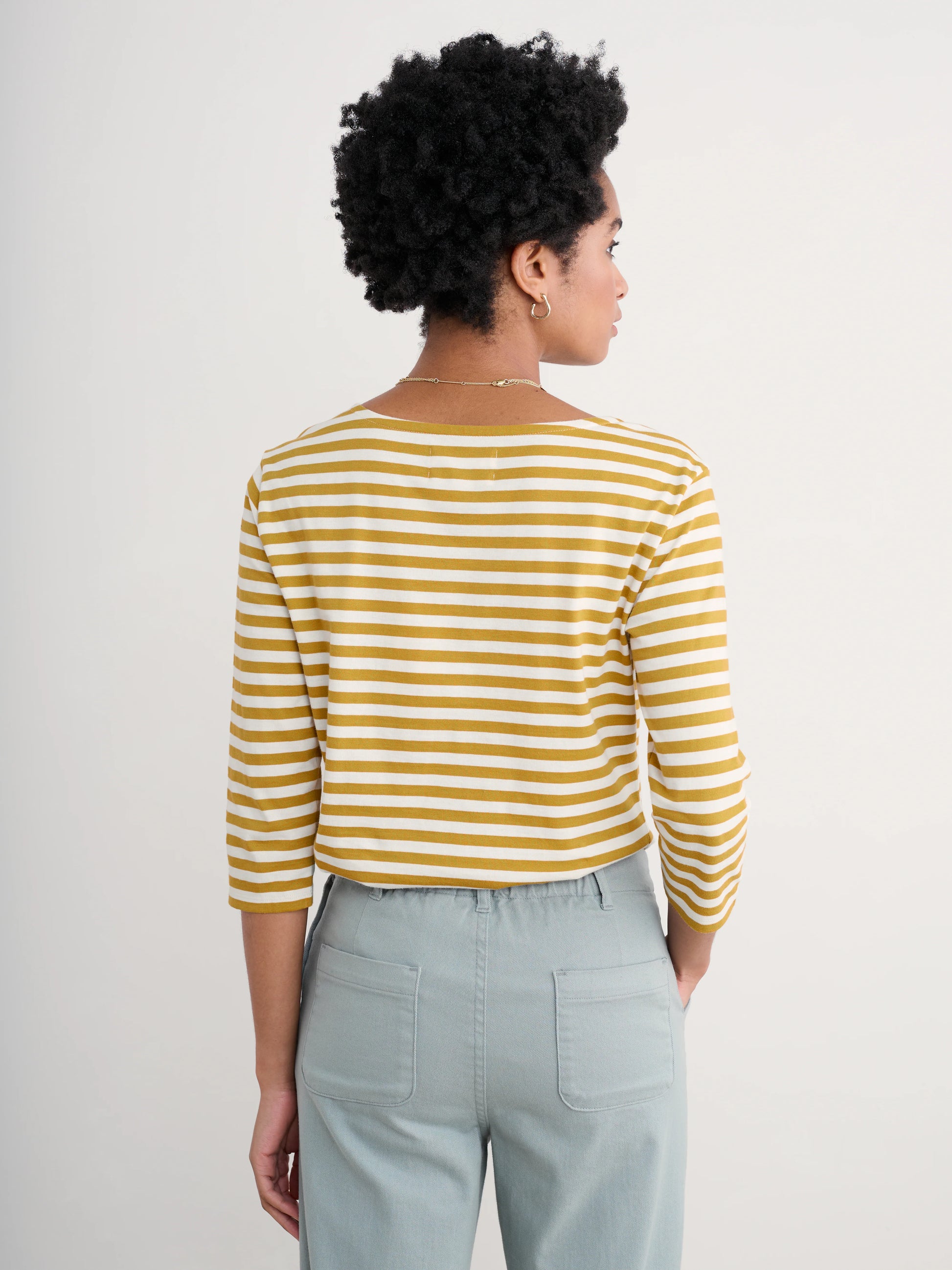 Woman wearing the Sailor cotton Top in Mini Cornish Chamomile Chalk stripes by SEASALT