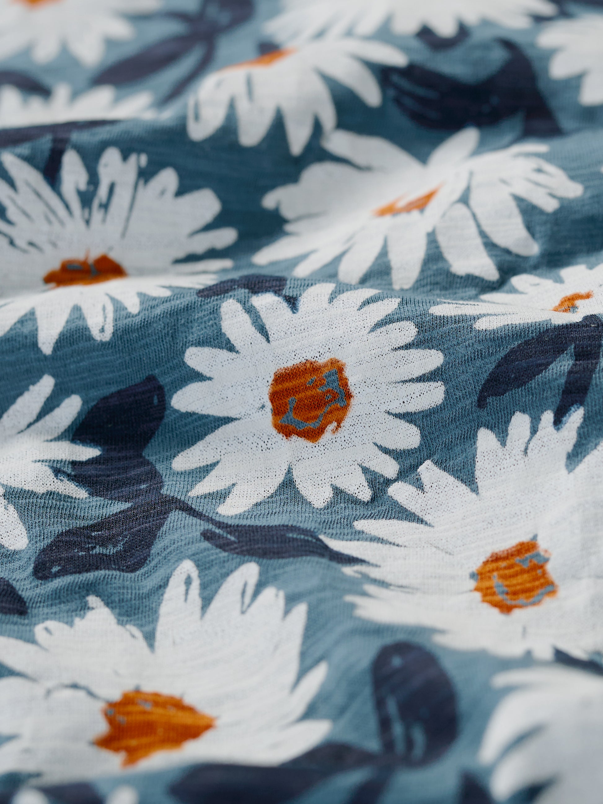 Close up of the Arty Daisy Dusky Jade pattern in the Studio Glass Top by SEASALT