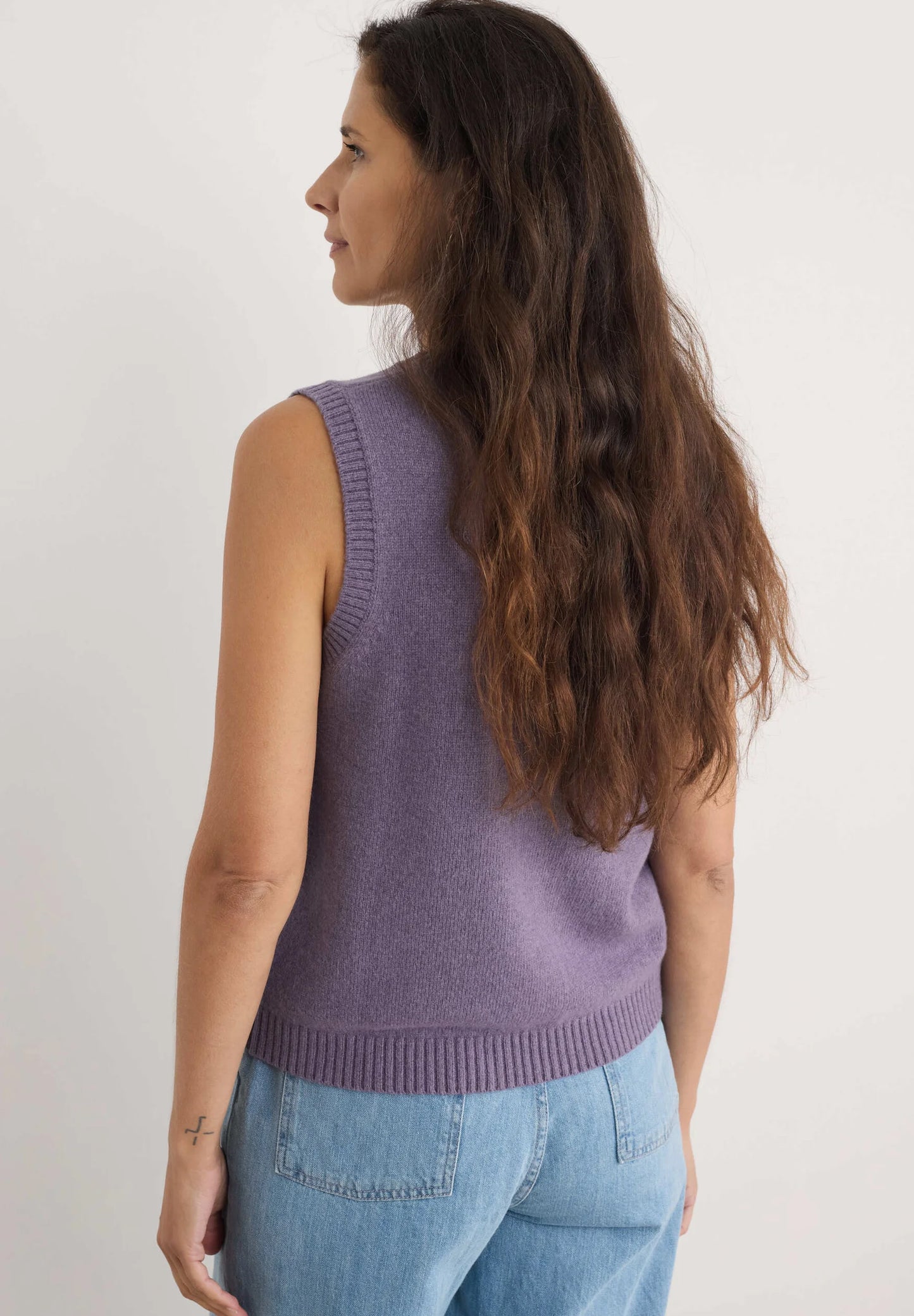 Woman wearing the East View wool Vest in Echium purple by SEASALT