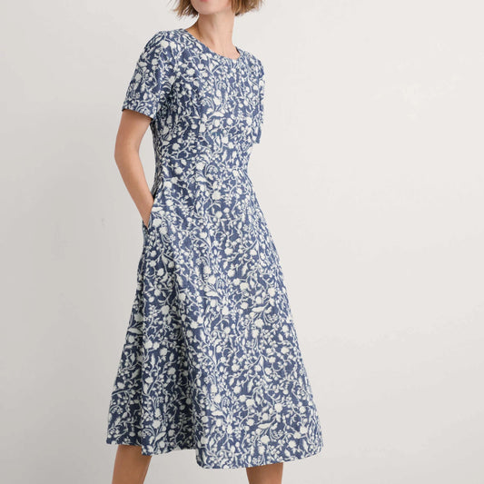 Woman wearing the Fox Path midi Dress in Shadow Blossom Indigo by SEASALT