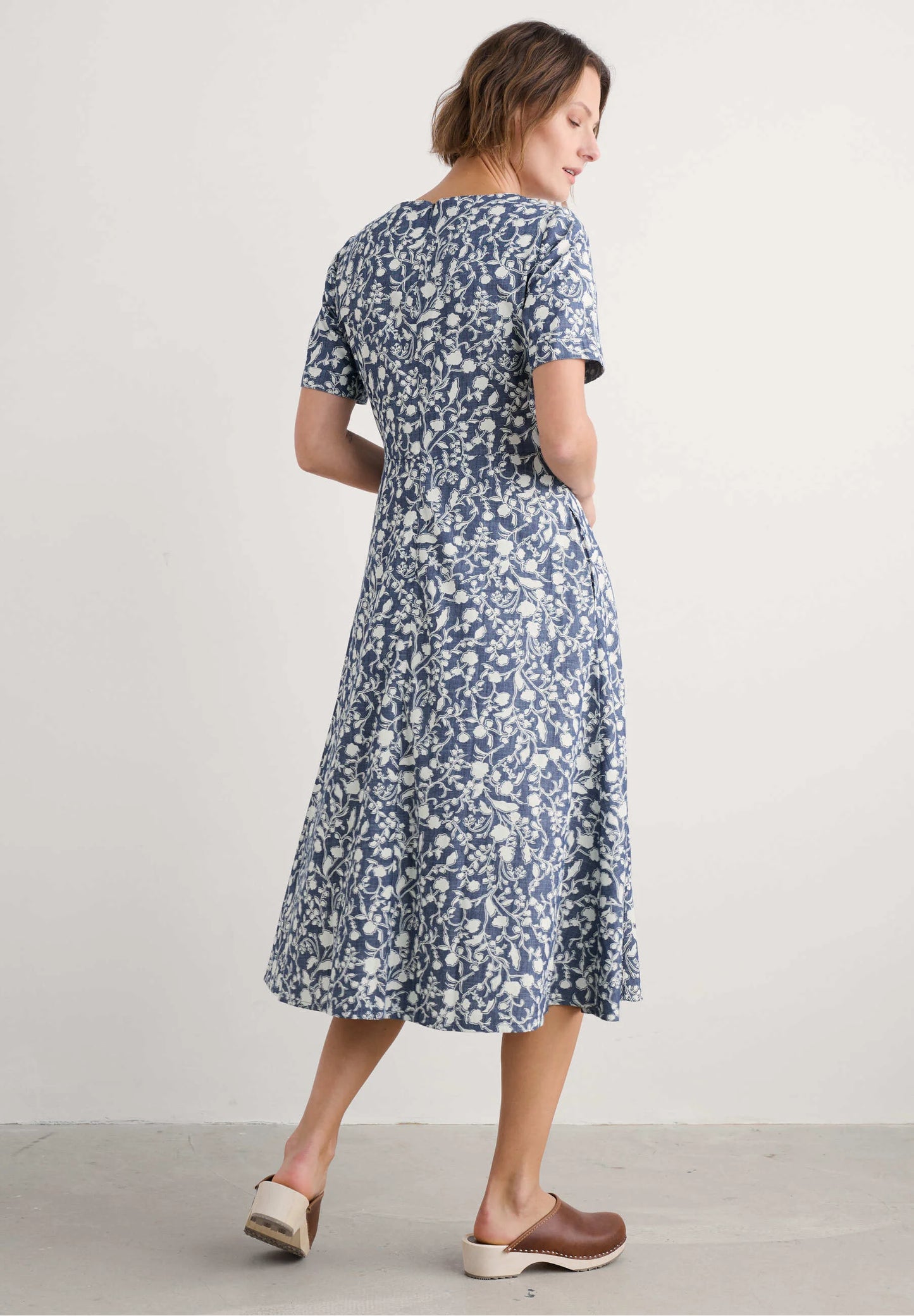 Woman wearing the Fox Path midi Dress in Shadow Blossom Indigo by SEASALT
